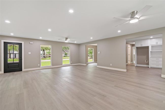 4th view of living/family area showing entry, breakfast room, and some of the kitchen area. | Image 21