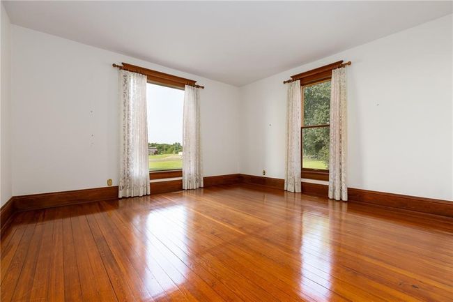 Unfurnished room with wood-type flooring and a wealth of natural light | Image 11