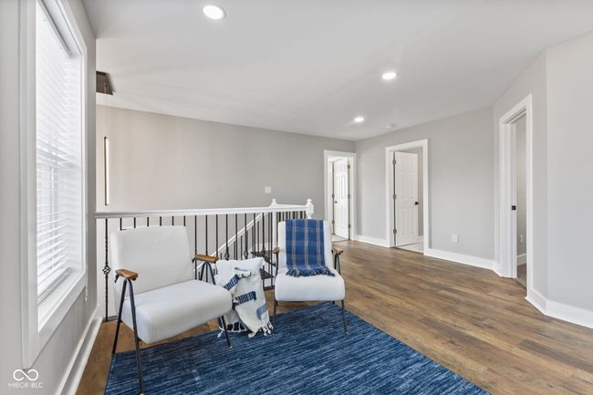 Loft or sitting room featuring wood finished floors, baseboards, and recessed lighting | Image 32