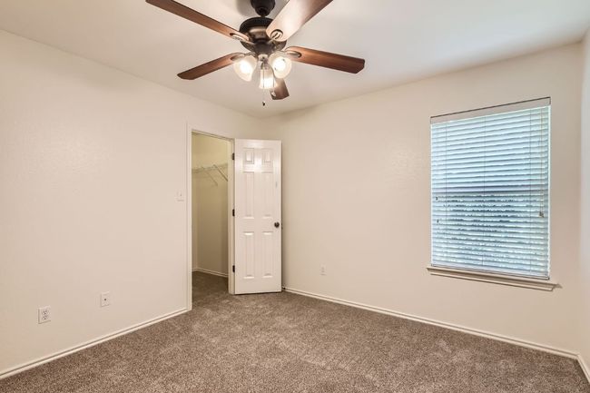 Spare room featuring carpet flooring and ceiling fan | Image 23