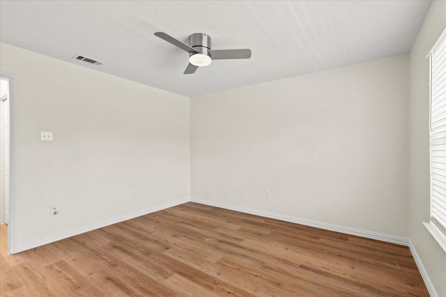 View of bedroom with connecting double closet into the bathroom | Image 21