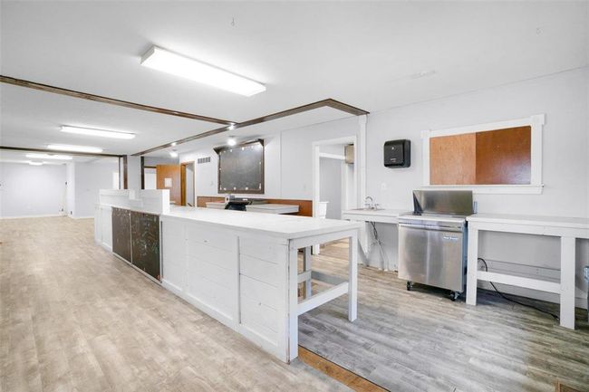 Prep space and order bar can easily be moved or taken out; some additional flooring is available to patch in. | Image 7