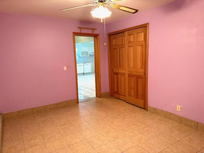 Spare room featuring ceiling fan | Image 21