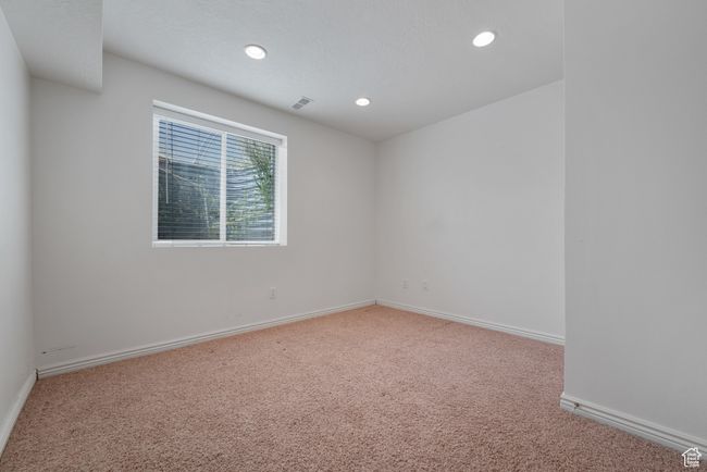 Carpeted empty room with recessed lighting and baseboards | Image 25