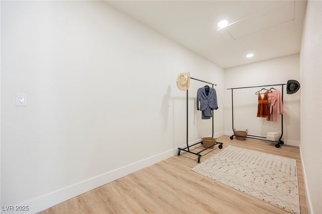 Walk-in primary suite closet! | Image 31