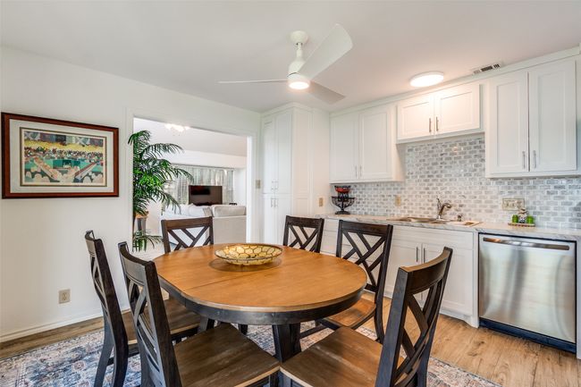 Dining area featuring light wood-type flooring and ceiling fan | Image 8