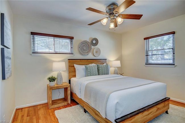 Primary bedroom features original hardwood oak floors. | Image 27