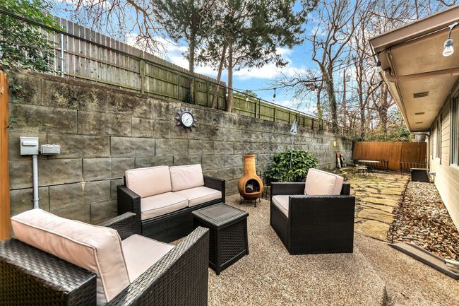 Fenced backyard featuring an outdoor living space and a patio | Image 28