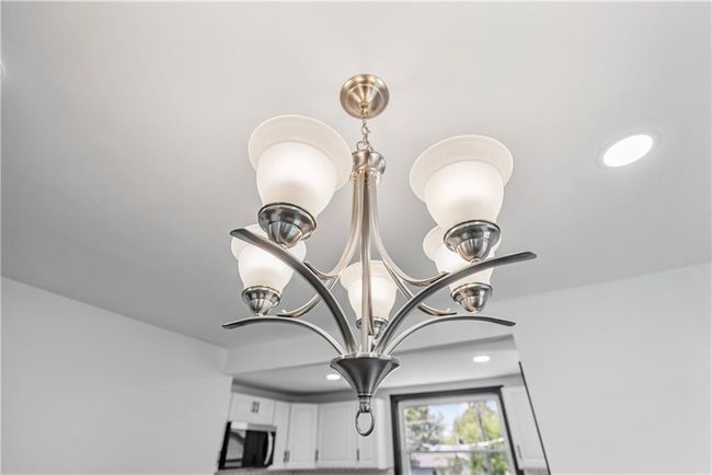 Detailed view of a chandelier and recessed lighting | Image 17