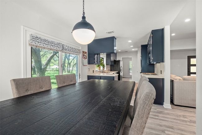 Dining space with light wood finished floors and recessed lighting | Image 13