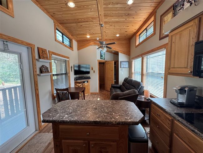 Kitchen with wood ceiling, light wood-type flooring, recessed lighting, high vaulted ceiling, and open floor plan | Image 32