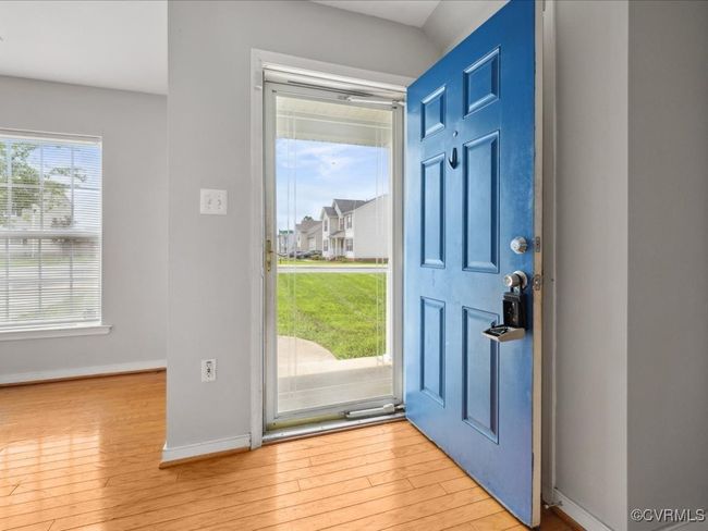 Foyer with wood finished floors and baseboards | Image 6