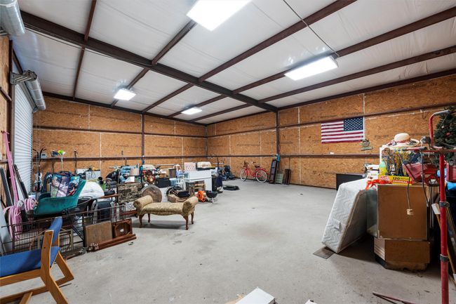 Garage featuring metal wall | Image 36