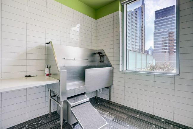 Miscellaneous room with a city view and tile walls | Image 26