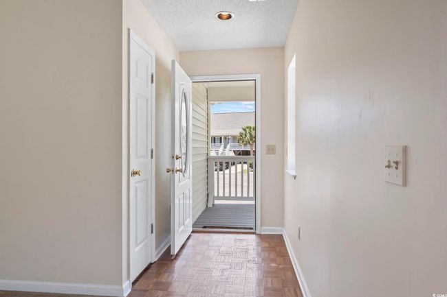 Entryway featuring baseboards and a textured ceiling | Image 10