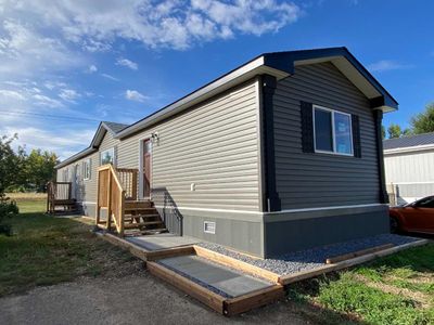 19 Maple Dr W, Home with 3 bedrooms, 2 bathrooms and 2 parking in Brooks AB | Image 1