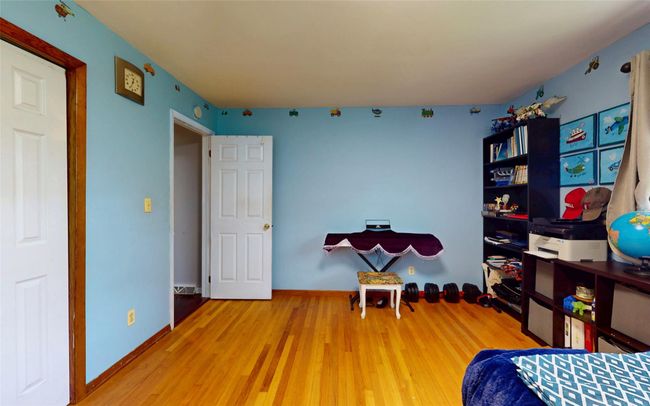 Bedroom with wood finished floors | Image 34