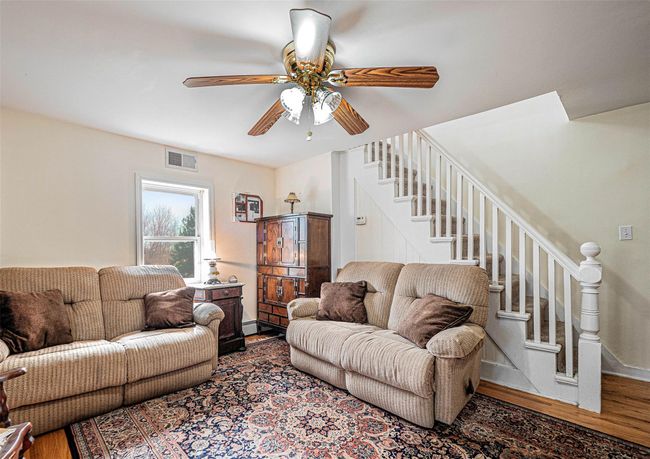 Living room with ceiling fan and hardwood / wood-style floors | Image 8