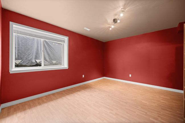 Empty room featuring wood finished floors and baseboards | Image 32