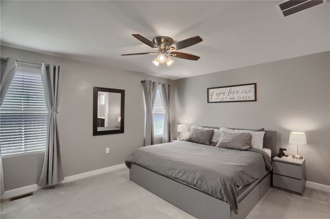 Large room with double windows flooding the room with light. Added ceiling fan. | Image 37