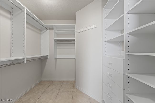 Walk in closet featuring light tile patterned floors | Image 28
