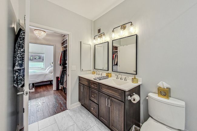 Primary Bathroom with Black trimmed Mirrors and Va | Image 24