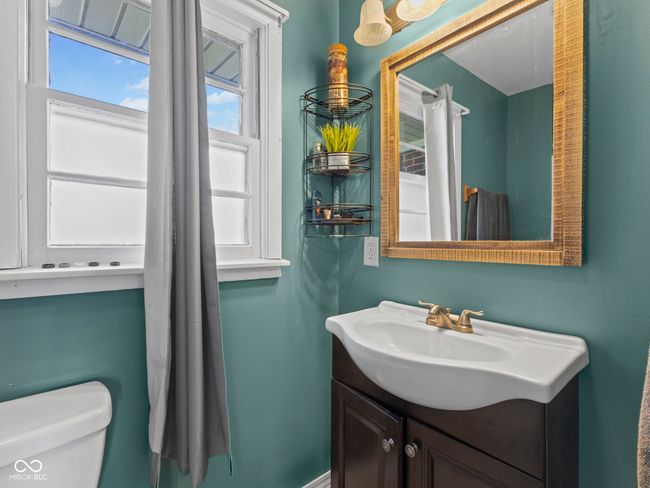 bathroom featuring toilet and vanity | Image 20