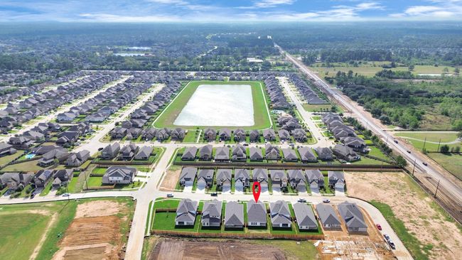 The residence is located just a few streets away from the community lake and a charming picnic area nestled beneath the large beautiful oak trees. | Image 5