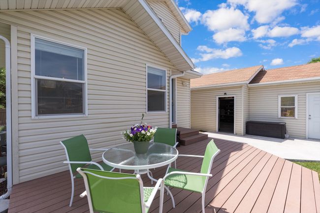 Backyard Trex deck terrace featuring outdoor dining area | Image 35