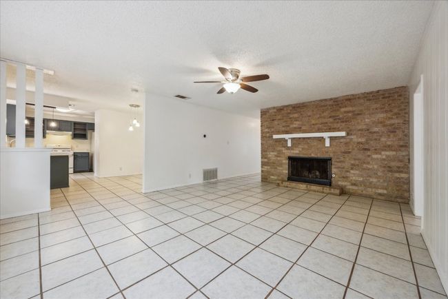 Living room with fireplace off Kitchen | Image 6
