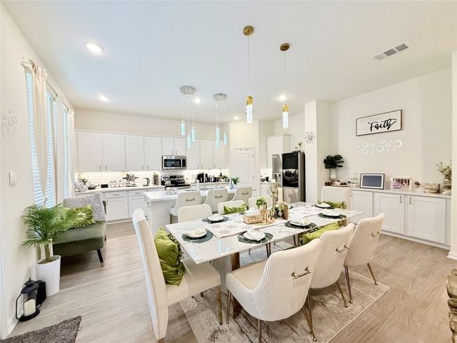 Dining room featuring light wood-style floors and recessed lighting | Image 6