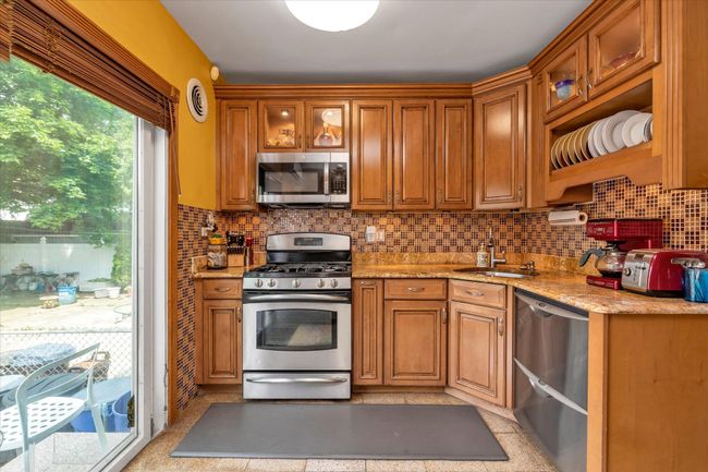 2 - 48 206 Th St, Home with 5 bedrooms, 2 bathrooms and 3 parking in Oakland Gardens NY | Image 9