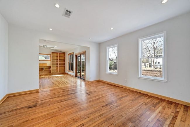 Unfurnished living room with visible vents, recessed lighting, baseboards, and light wood-style floors | Image 7