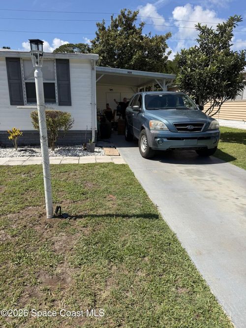 909 Vireo Dr, Barefoot Bay, FL, 32976-7350 | Card Image