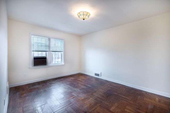 Spare room with visible vents, cooling unit, and baseboards | Image 11
