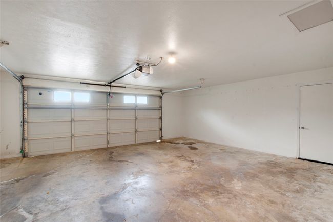 Garage with a garage door opener | Image 17