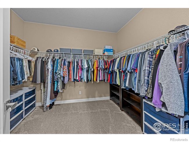Oversized walk-on primary closet adjoining the primary bath | Image 16