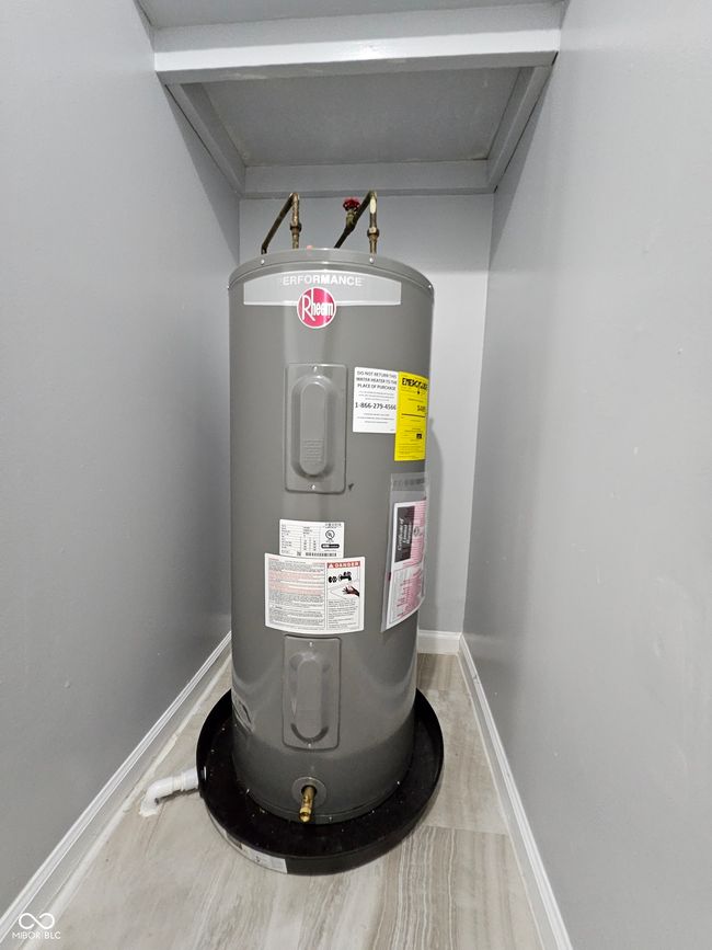 utility room with water heater | Image 5