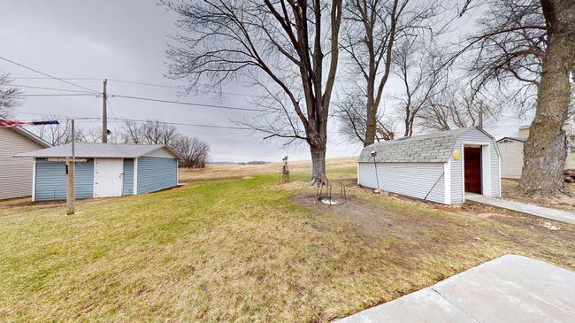 Backyard to sheds and field | Image 29