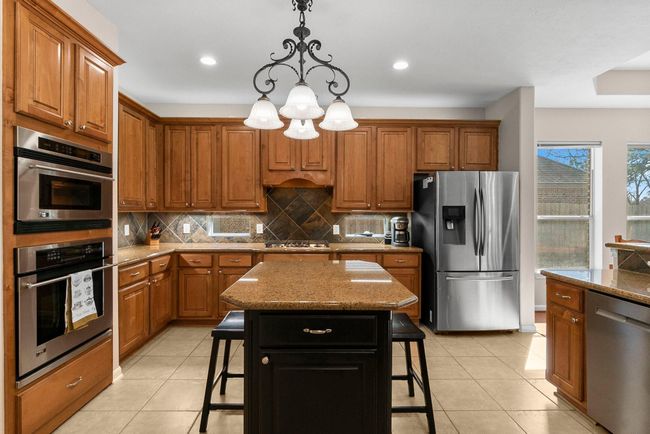 25327 Metzler Creek Dr, House other with 5 bedrooms, 4 bathrooms and 2 parking in Spring TX | Image 5