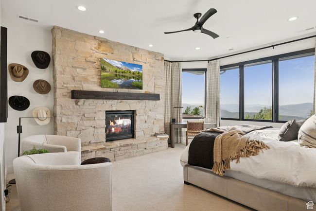 Bedroom featuring a fireplace, carpet, recessed lighting, and a ceiling fan | Image 35
