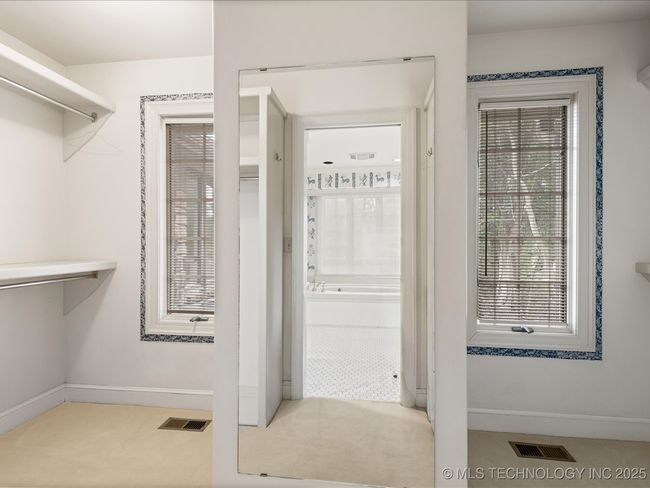 Dual sided walk-in closet in Primary | Image 30