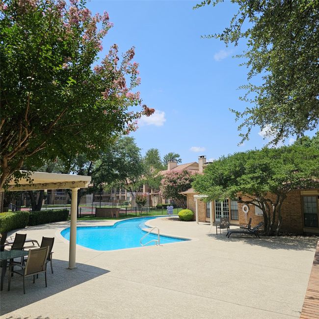 Community pool with a patio and french doors | Image 5