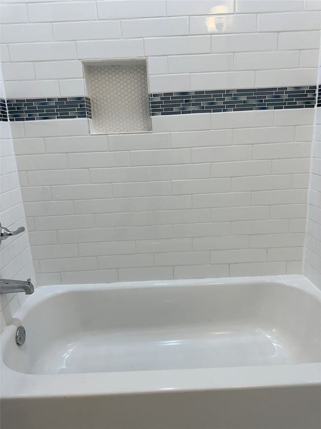Bathroom featuring bathtub | Image 17