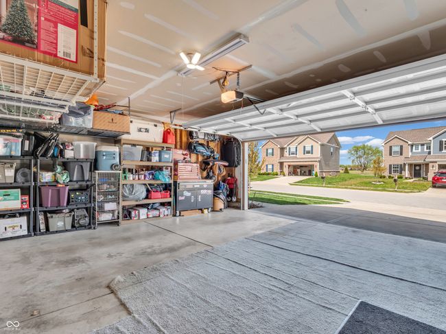 garage with a garage door opener | Image 37