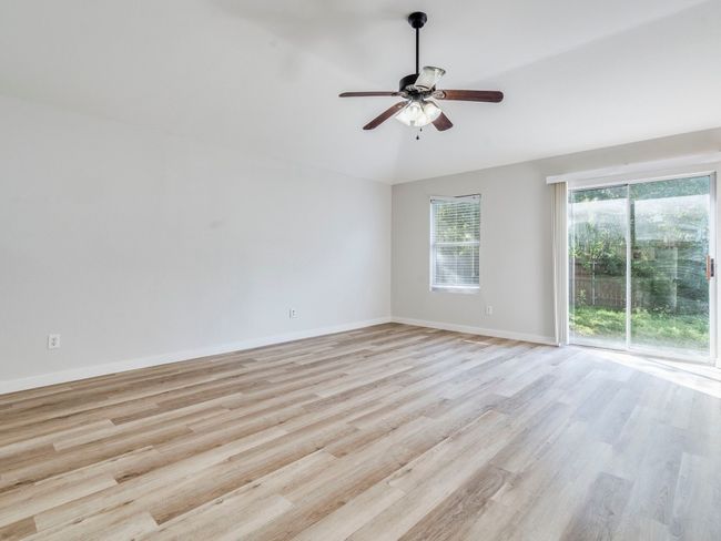 Freshly installed flooring features a neutral wood tone. | Image 10