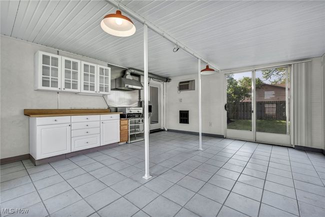 Unfurnished sunroom featuring a wall unit AC | Image 34