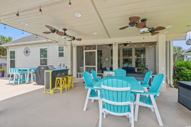 View of patio / terrace with outdoor dining area, a ceiling fan, and a grill | Image 26