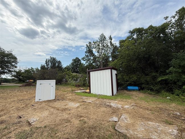 View of yard featuring a storage shed | Image 7