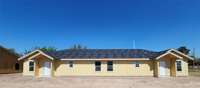 Back of house with board and batten siding | Image 11